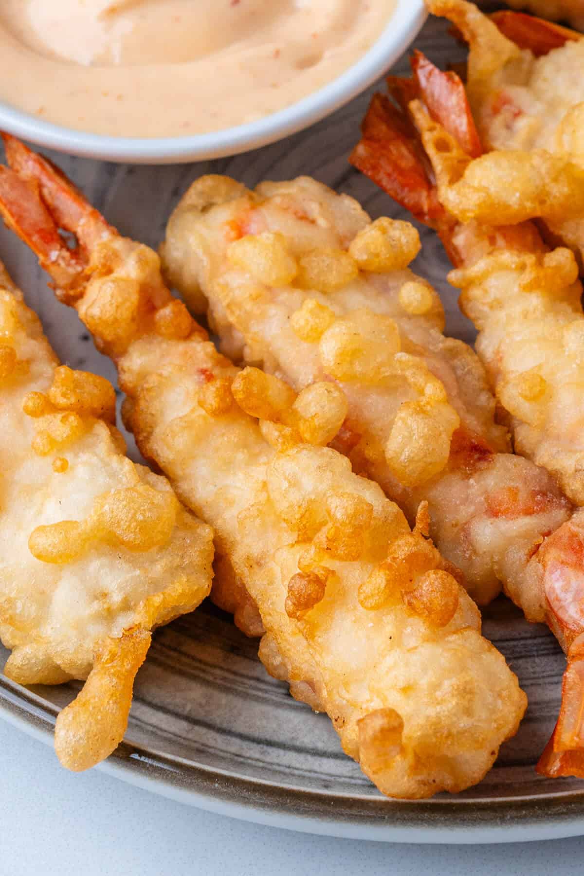 Close-up of crispy shrimp tempura with golden batter texture